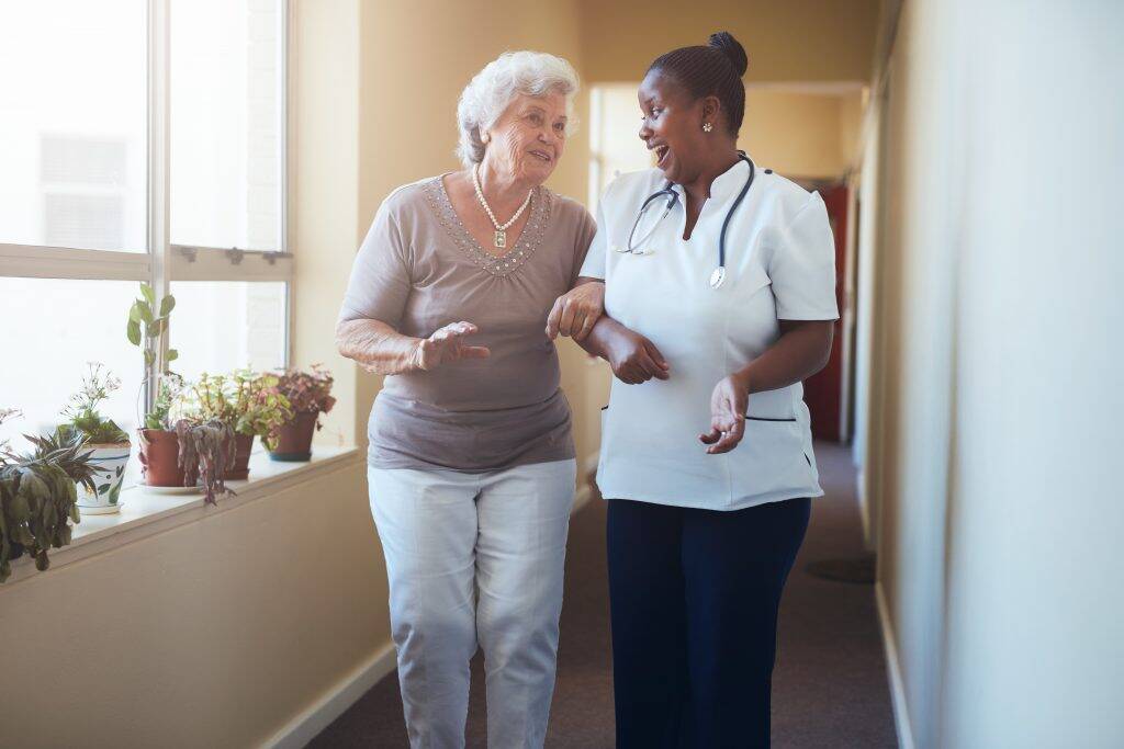 happy-healthcare-worker-walking-and-talking-with-s-P9FVKDL-1024x683 happy-healthcare-worker-walking-and-talking-with-s-P9FVKDL-1024x683