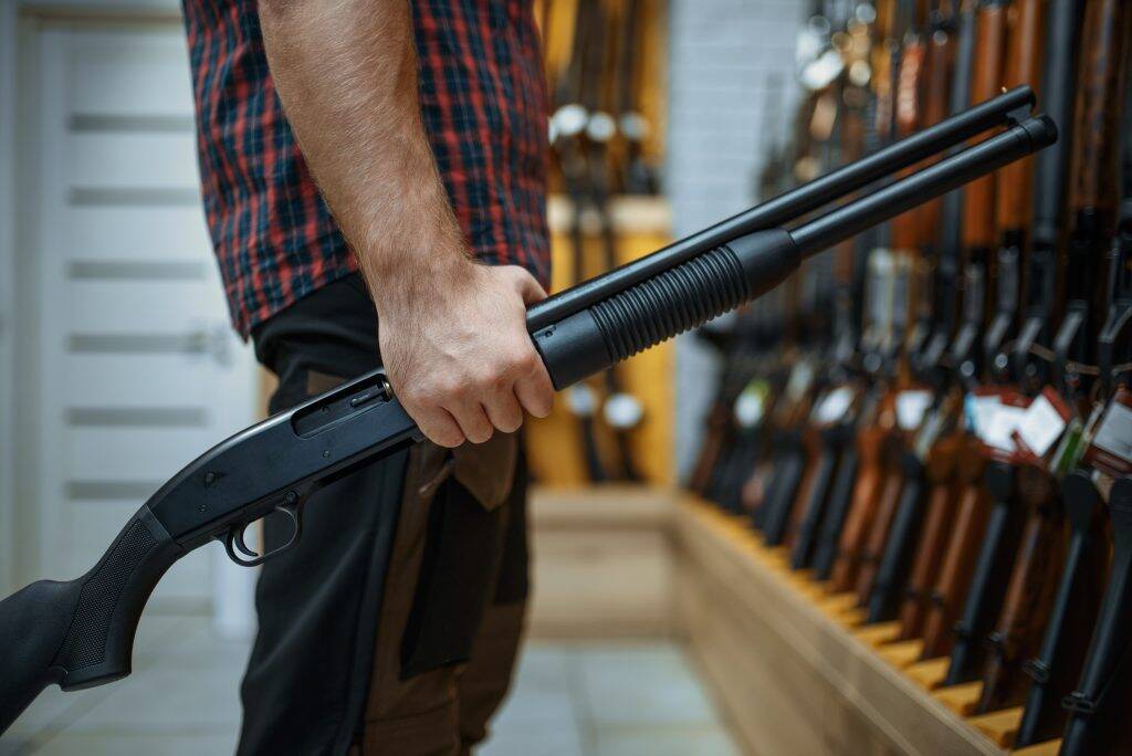 male-person-with-rifle-at-showcase-in-gun-shop-PP65Q2K-1024x684 male-person-with-rifle-at-showcase-in-gun-shop-PP65Q2K-1024x684