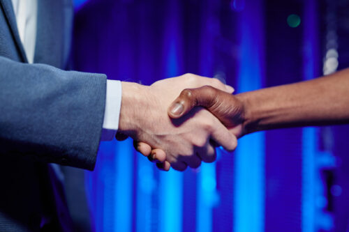 People Shaking Hands in Data Center