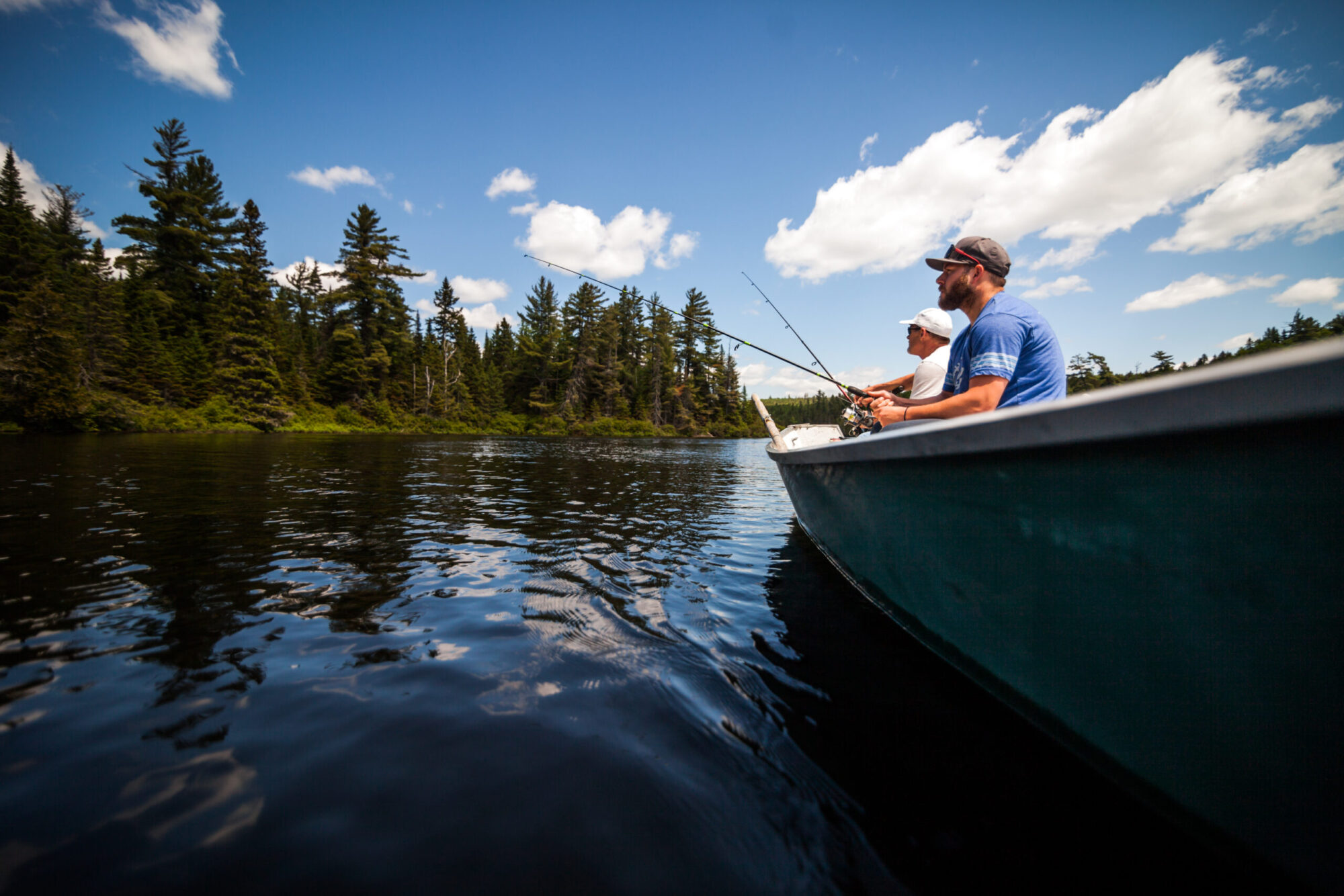 Sun and Father Fishing in a Calm Lake in Wild Nature.
