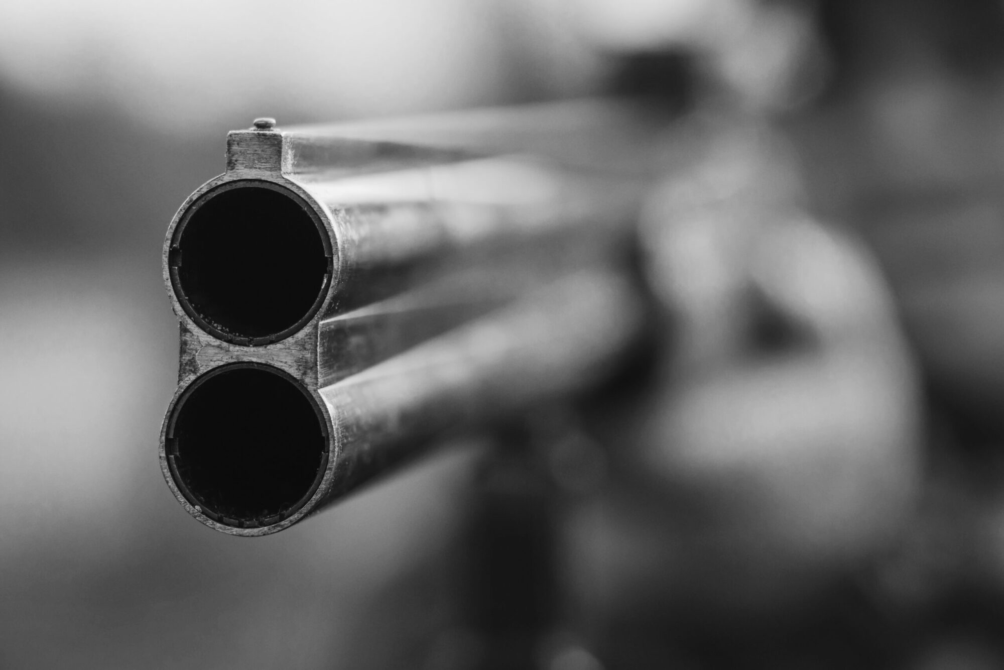 Close up of double barrel hunting gun. Black and white