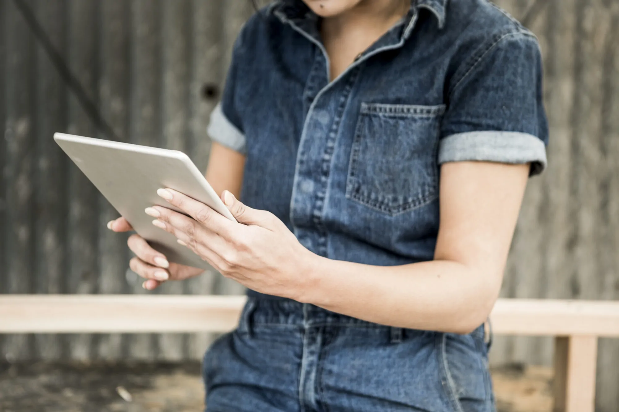 Female carpenter using a tablet Female carpenter using a tablet