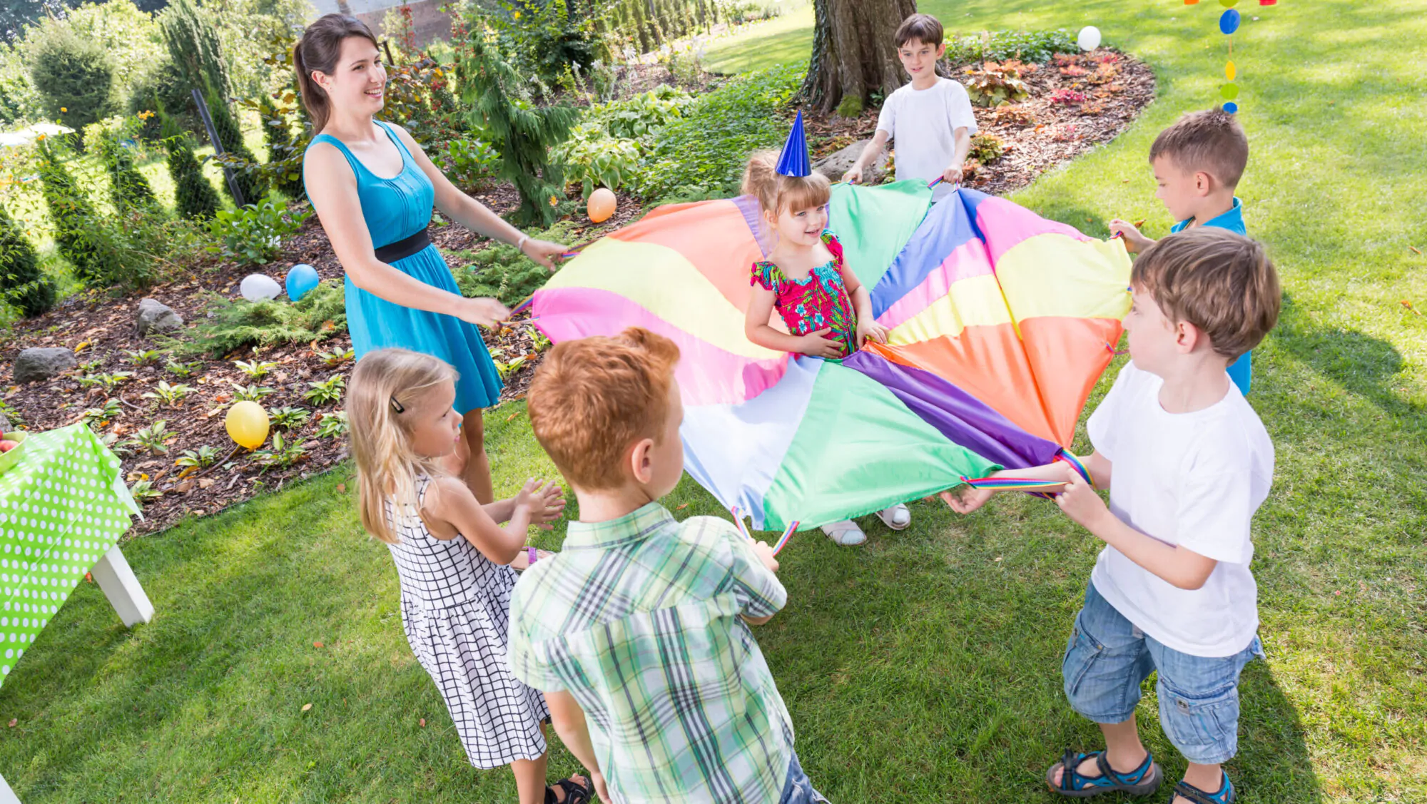 Kids playing parachute games