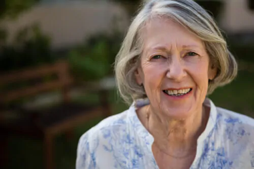Portrait of happy senior woman at park