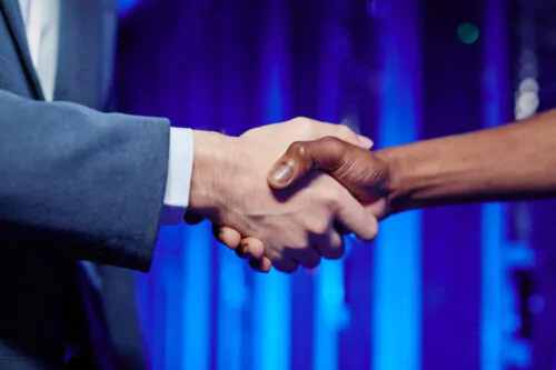 People Shaking Hands in Data Center