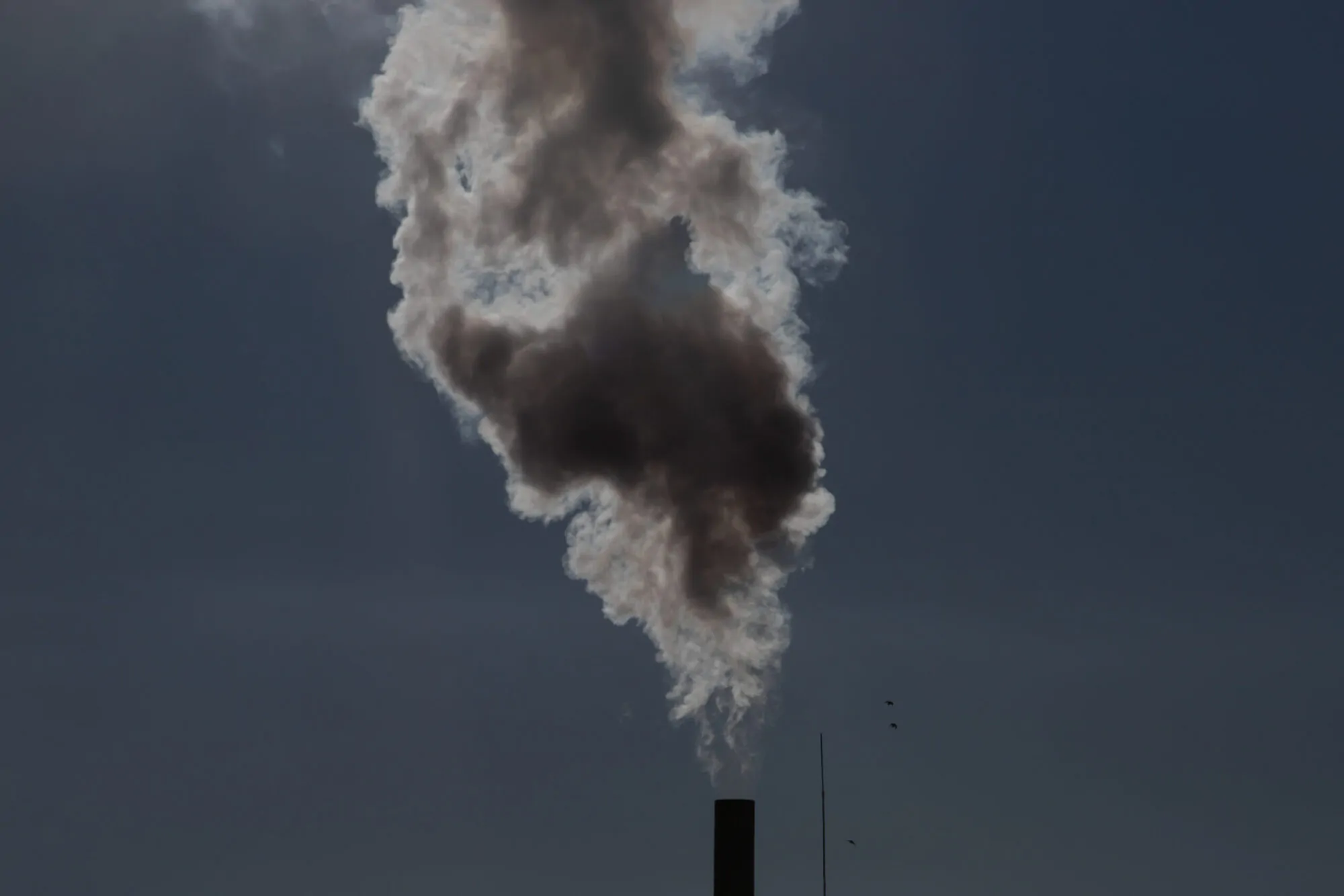 Smoke coming out of factory chimney.