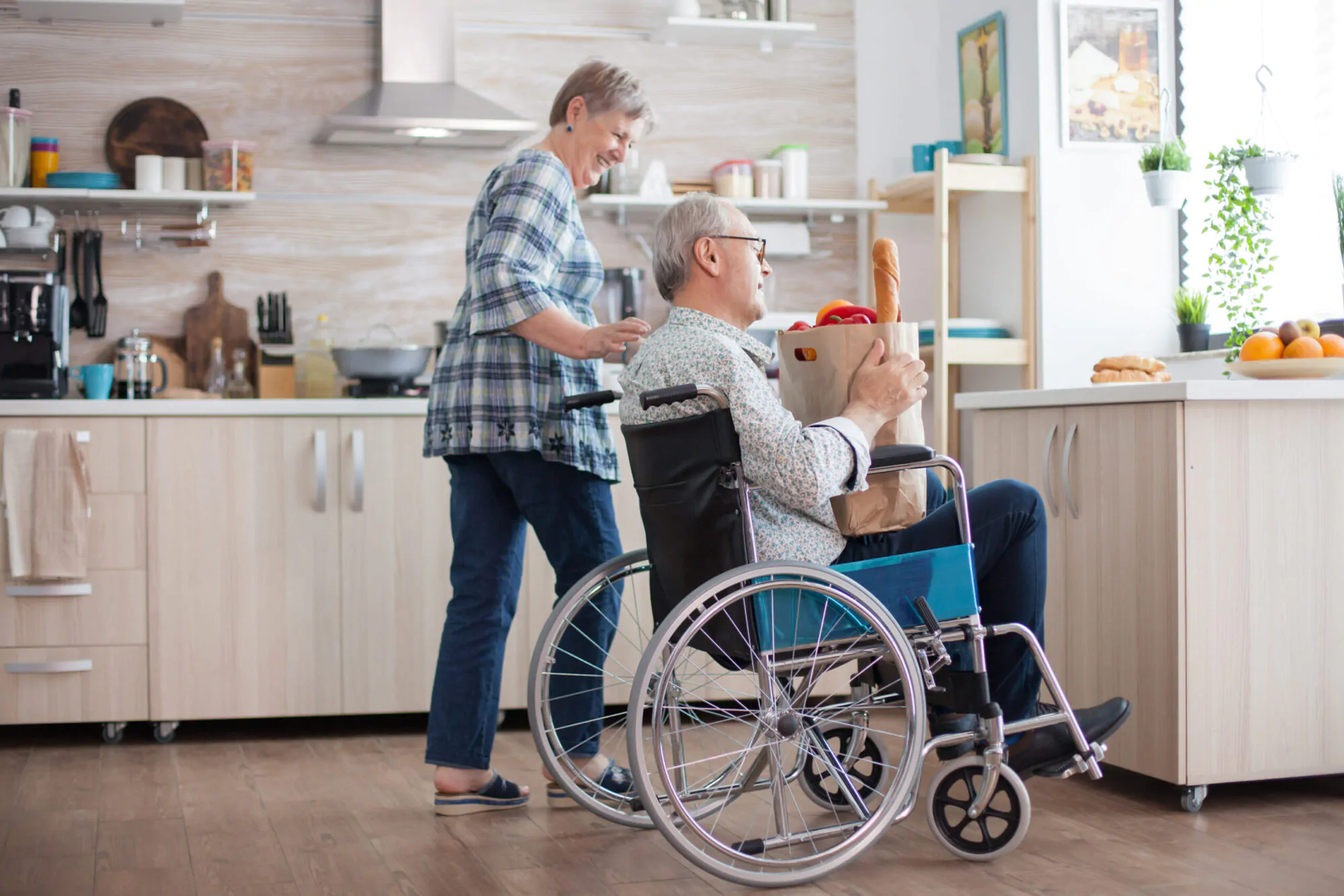 Cheerful wife helping disabled husband