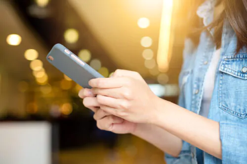 Young woman use of mobile phone